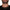 Gold chain necklace on man wearing black shirt, close-up jewelry photo